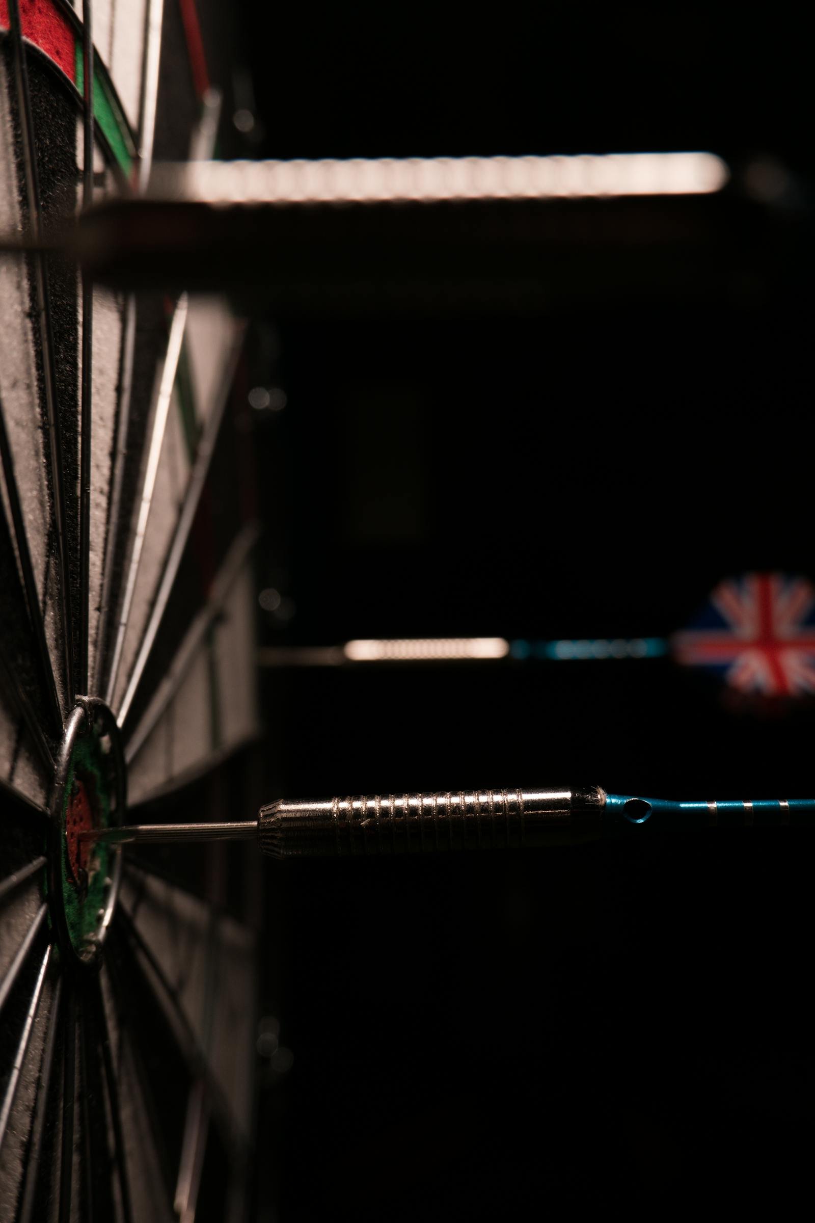 Darts hitting a bullseye on a dartboard against a black background illustrating How to Find Your Creator Niche: 5-Step Framework