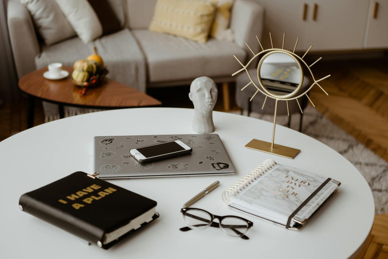 Stylish home office setup with planner and tech devices for productivity