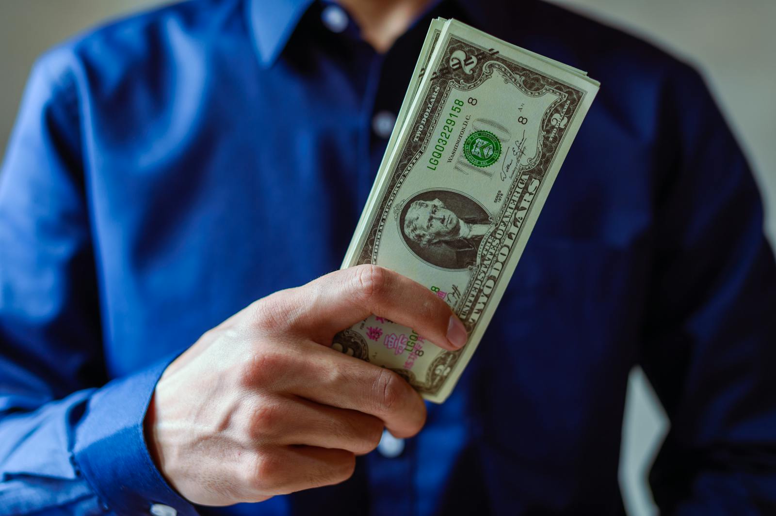 Close-up of dollar bills, illustrating wealth and finance concept