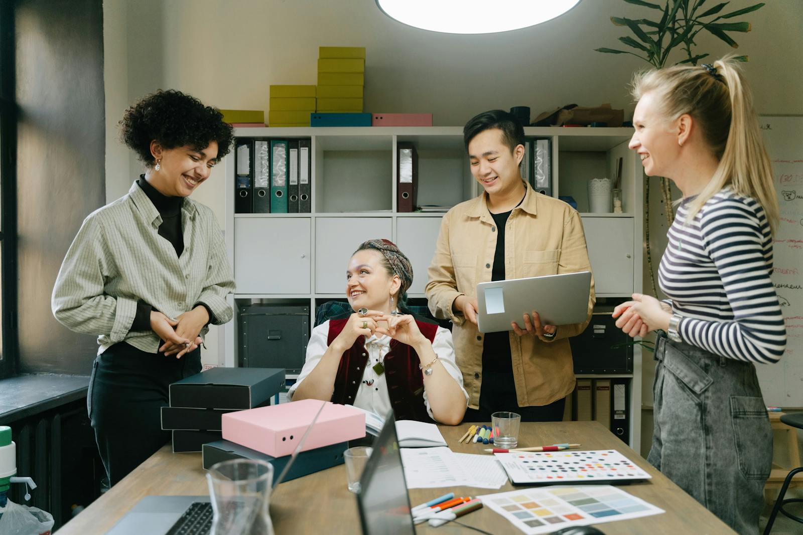 Colleagues engaged in team meeting in modern office setting