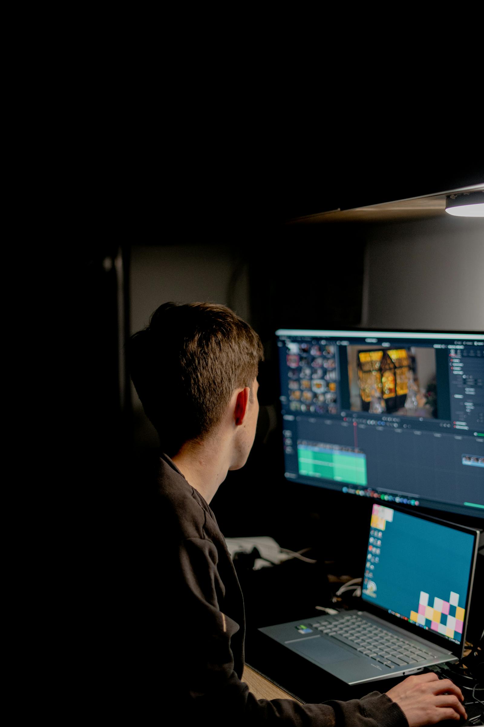 Video editing on dual screens, illustrating Pictory AI video creation