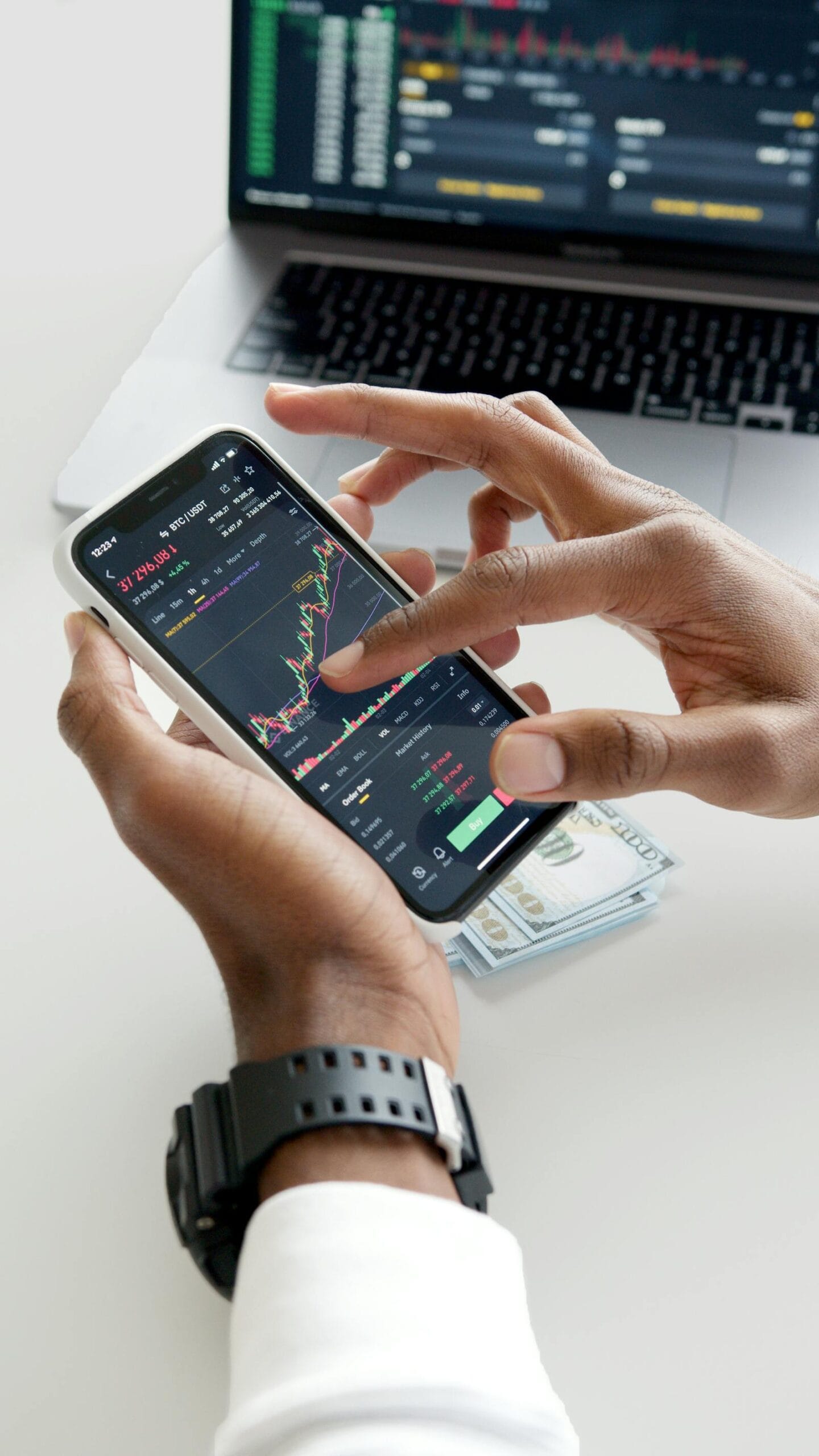 Smartphone displaying stock trading app with green chart, illustrating Robinhood broker review