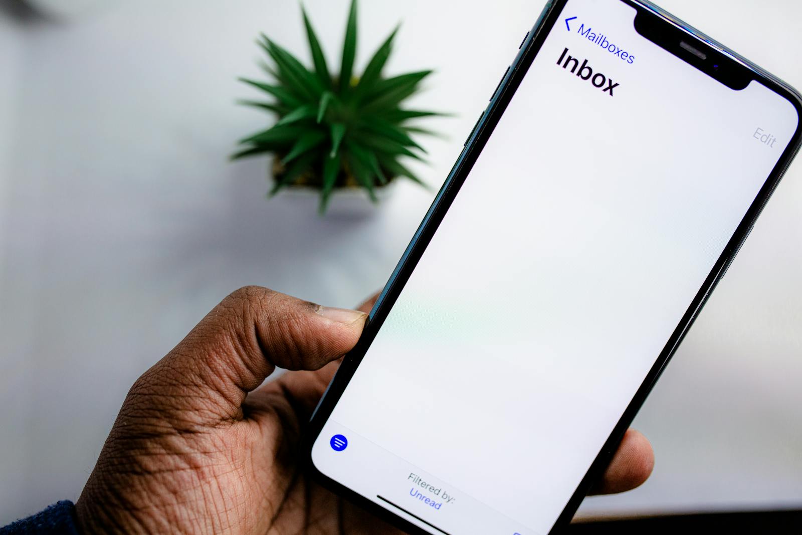 Smartphone displaying email inbox with subscriber notifications, illustrating email list building