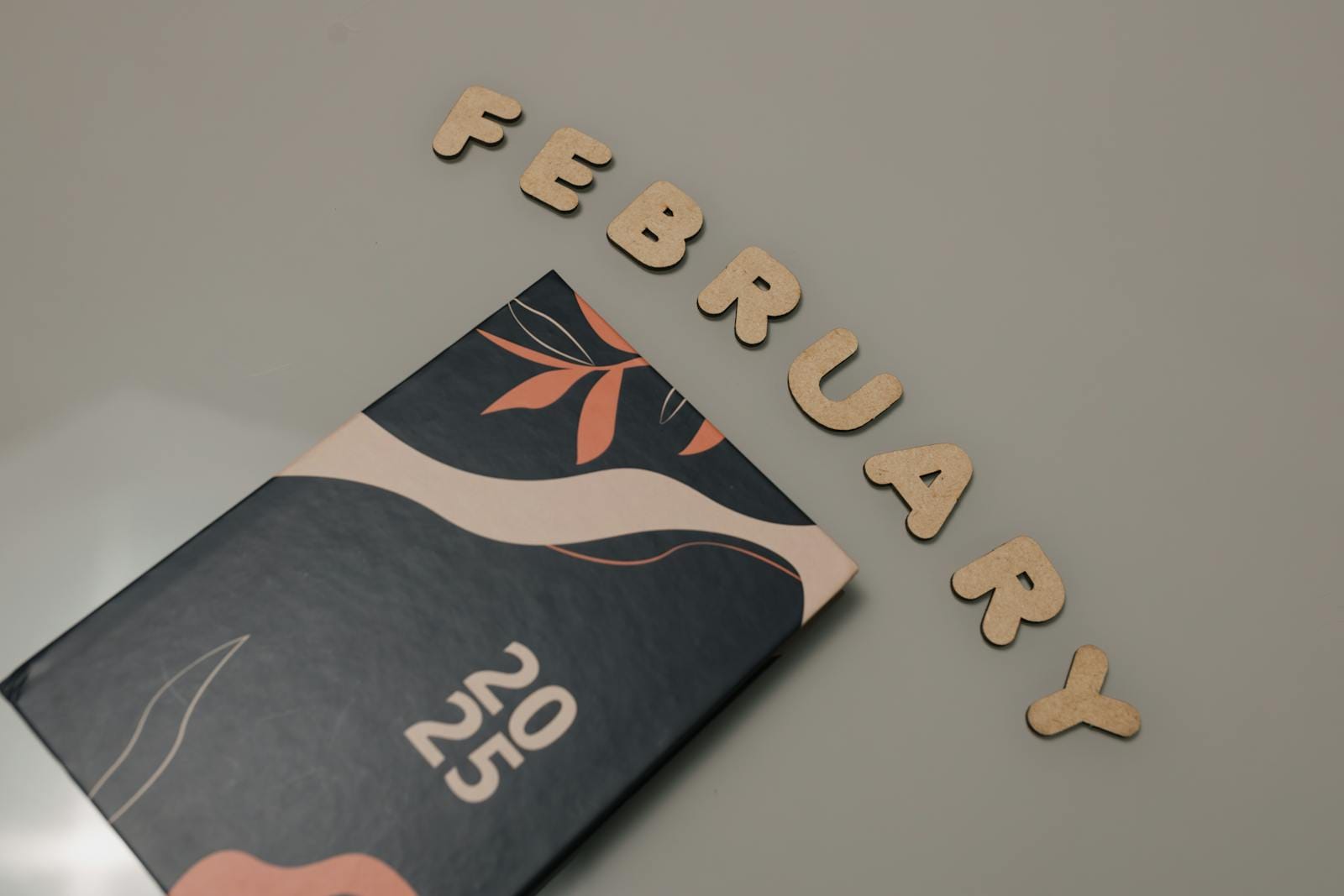 Stylish planner with abstract design and February text